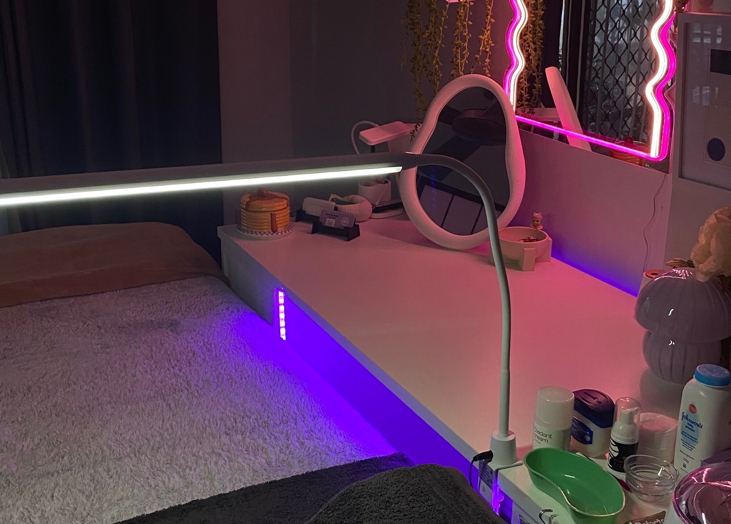 Cozy treatment room at Pretty In Paradise Beauty, Toormina, New South Wales, AU, with ambient lighting.