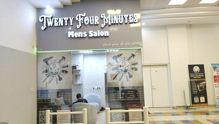 Front view of 24 minutes men's salon in Abu Dhabi, AE, featuring stylish branding and modern decor.