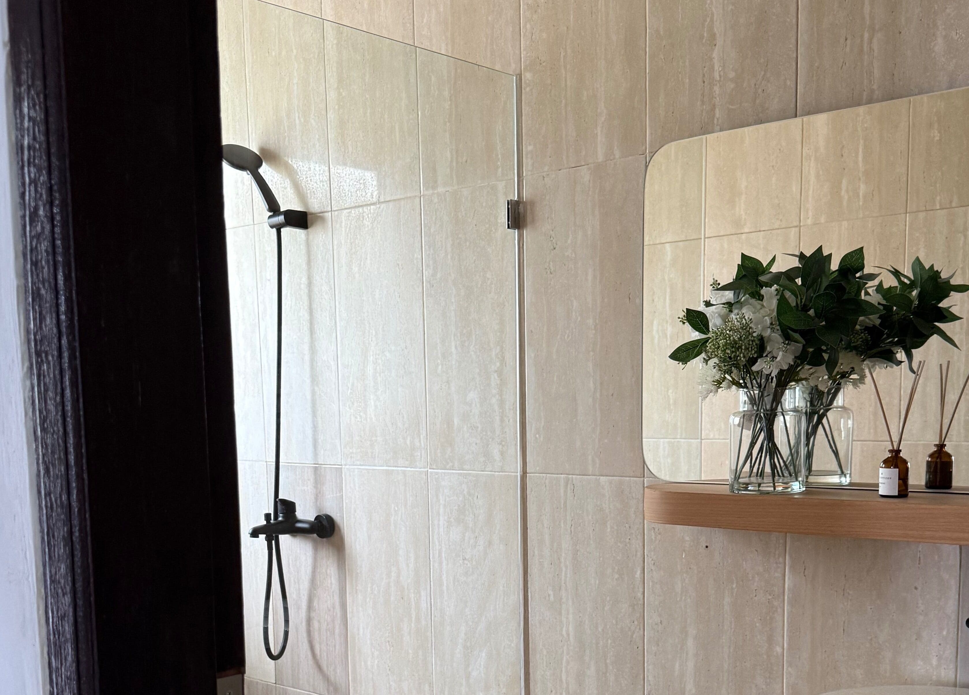 Elegant shower area with floral decor at Body Wonders SPA & Massage, Bali, Bali, ID.