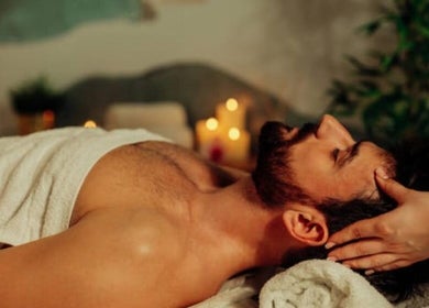 Man receiving a relaxing massage at Dolce Relax Unisex Salon and Spa Wellness in Bangalore, IN.