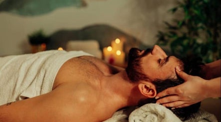 Man receiving a relaxing massage at Dolce Relax Unisex Salon and Spa Wellness in Bangalore, IN.