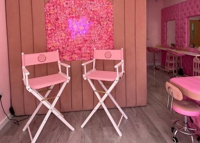 Stylish pink interior of Liberty Autumn Aesthetics, Southampton, England, GB, with floral decor and beauty chairs.