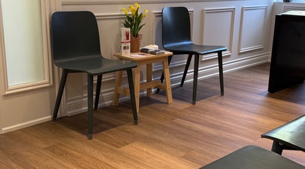 Inviting waiting area at Glamify Wellness Spa, Vaughan, Ontario, CA with modern chairs and decor.
