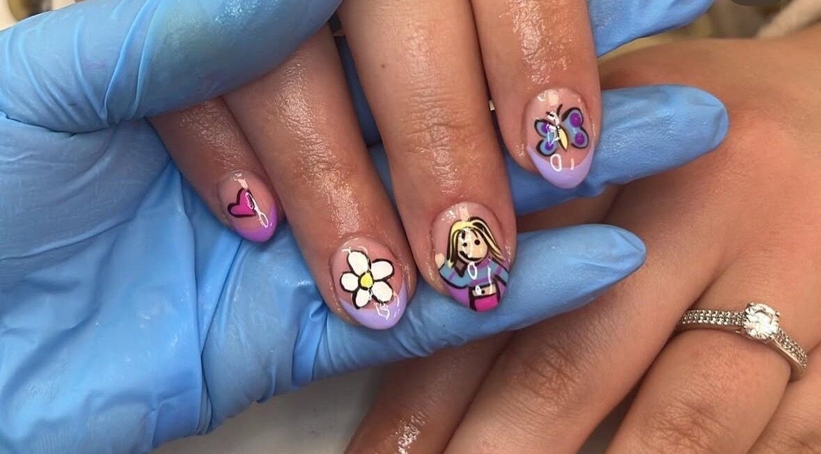 Artistic nail art with flowers and hearts at Glam by Rachel, Bedford, England, GB.