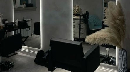 Modern salon seating area at Sallybraids in Toronto, Ontario, CA, featuring sleek chairs and stylish decor.
