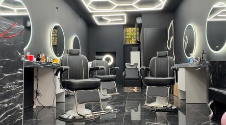 Stylish interior of Euro Cut Barber in Roma, Lazio, IT with modern barber chairs and illuminated mirrors.