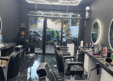 Interior of Euro cut Barber in Roma, Lazio, IT with modern chairs and mirrors enhancing the elegant space.
