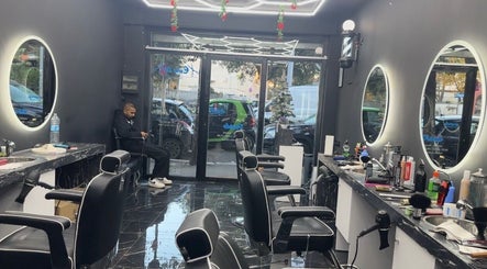 Interior of Euro cut Barber in Roma, Lazio, IT with modern chairs and mirrors enhancing the elegant space.