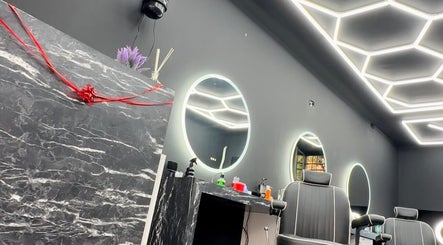 Sleek interior of Euro cut Barber in Roma, Lazio, IT featuring modern mirrors and stylish chairs.