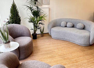 Modern lounge area at Vera Beauty & Aesthetic, Brighton And Hove, England, GB with stylish seating and plants.