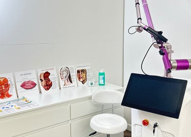 Cosmetic treatment station at Vera Beauty & Aesthetic, Brighton And Hove, England, GB with anatomy charts.