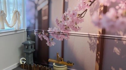 Serene cherry blossom decor at Wu Therapeutic Massage and Head Spa in Fairfax, Virginia, US.