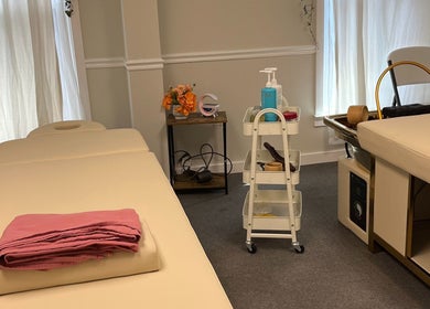 Relaxing massage room at Wu Therapeutic Massage and Head Spa, Fairfax, Virginia, US, featuring massage tables and decor.
