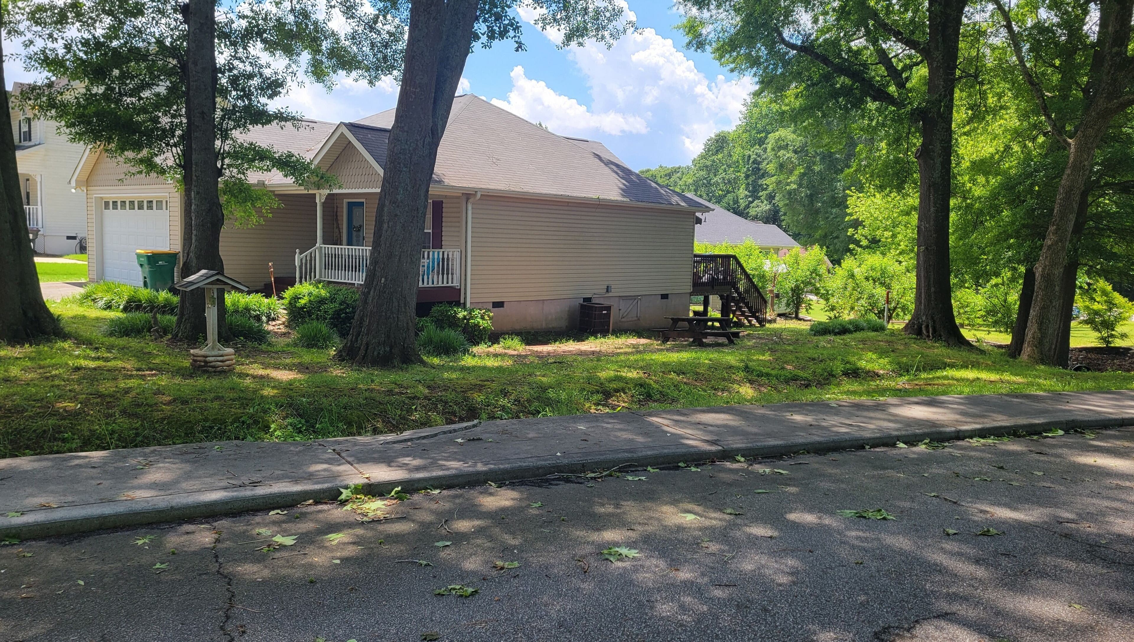Cozy home exterior surrounded by trees at Halo Majesty Hair, Lavonia, Georgia, US.