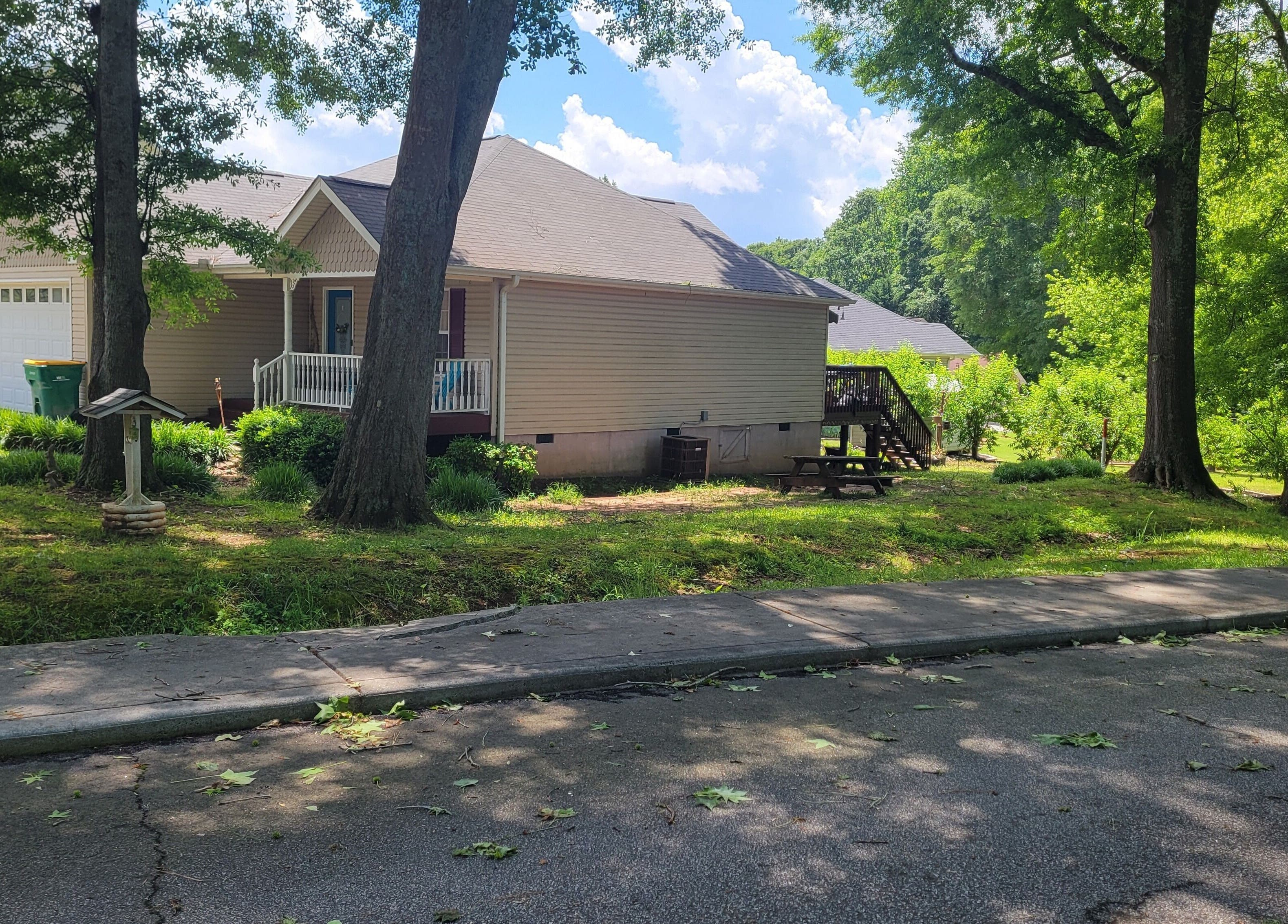 Cozy home exterior surrounded by trees at Halo Majesty Hair, Lavonia, Georgia, US.