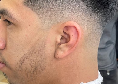Close-up of a stylish fade haircut at Kecho’s Barbershop in Dallas, Texas, US.
