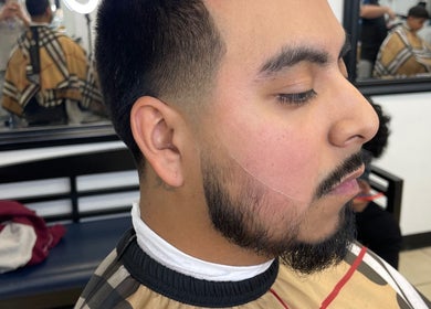 Close-up of a fresh haircut at Kecho’s Barbershop in Dallas, Texas, US showcasing precision fade styling.
