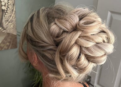 Intricate braided updo at Bylucydomeneghetti in Durham, England, GB, showcasing expert hairstyling.