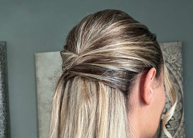 Elegant updo hairstyle showcased at Bylucydomeneghetti, Durham, England, GB, perfect for special occasions.