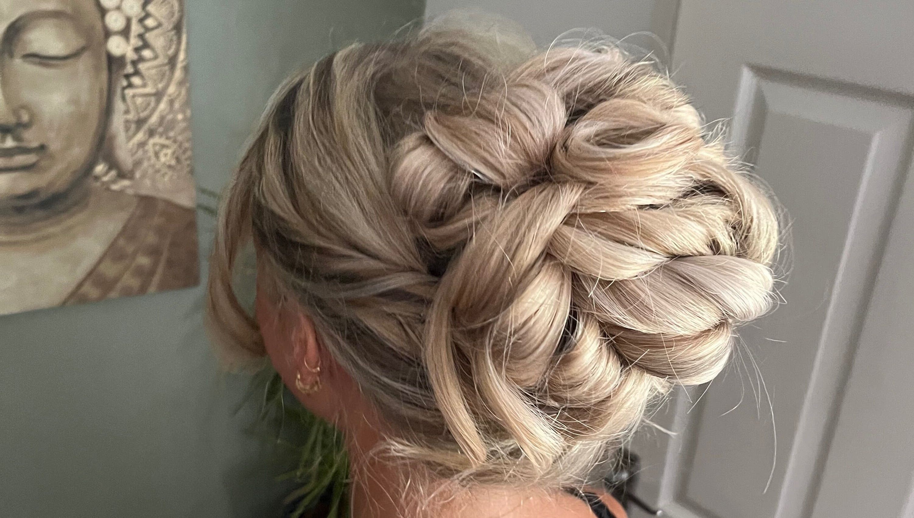 Elegant braided updo at Bylucydomeneghetti, Durham, England, GB. Perfect for events and occasions.