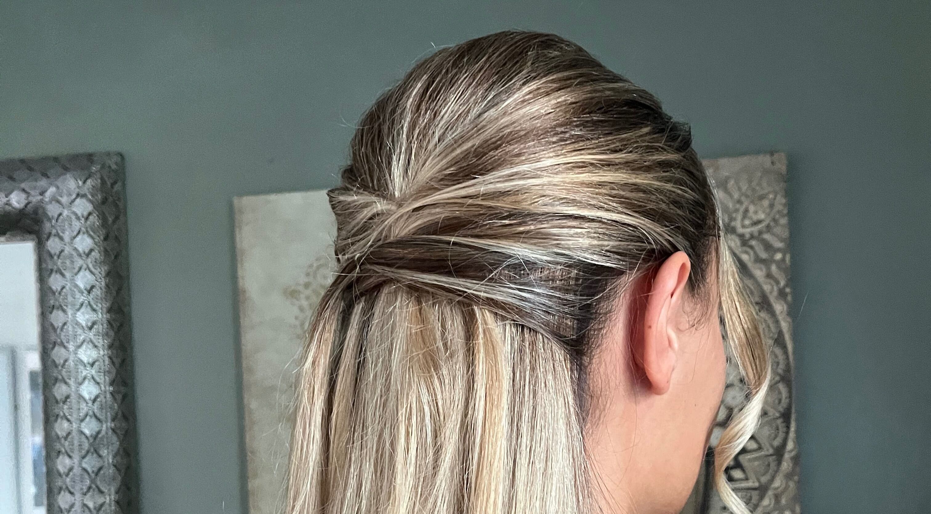 Elegant hairstyle at Bylucydomeneghetti in Durham, England, GB, showcasing a stylish updo with blonde highlights.