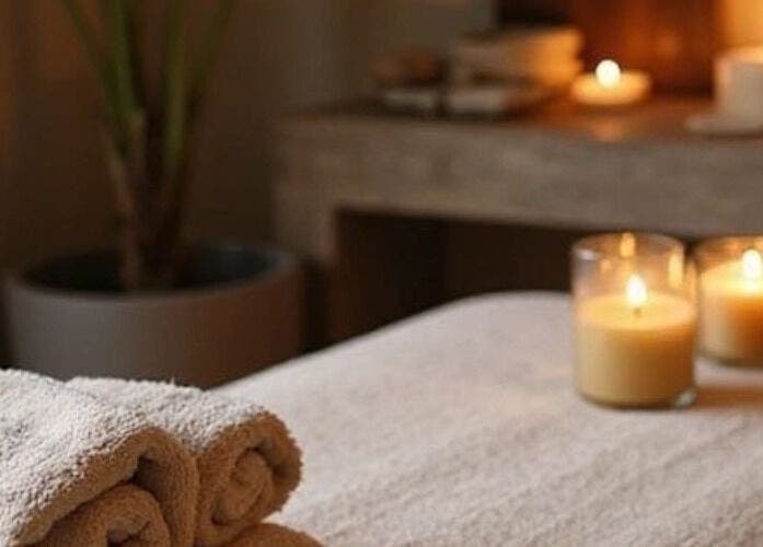 Relaxing massage setup at Tati’s Mobile Massage Service, Lusaka, Lusaka Province, ZM, with candles and towels.