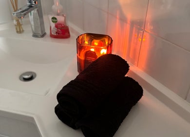 Luxurious spa setup at Azur Coast Massage by Jess in O'sullivan Beach, South Australia with candlelight.