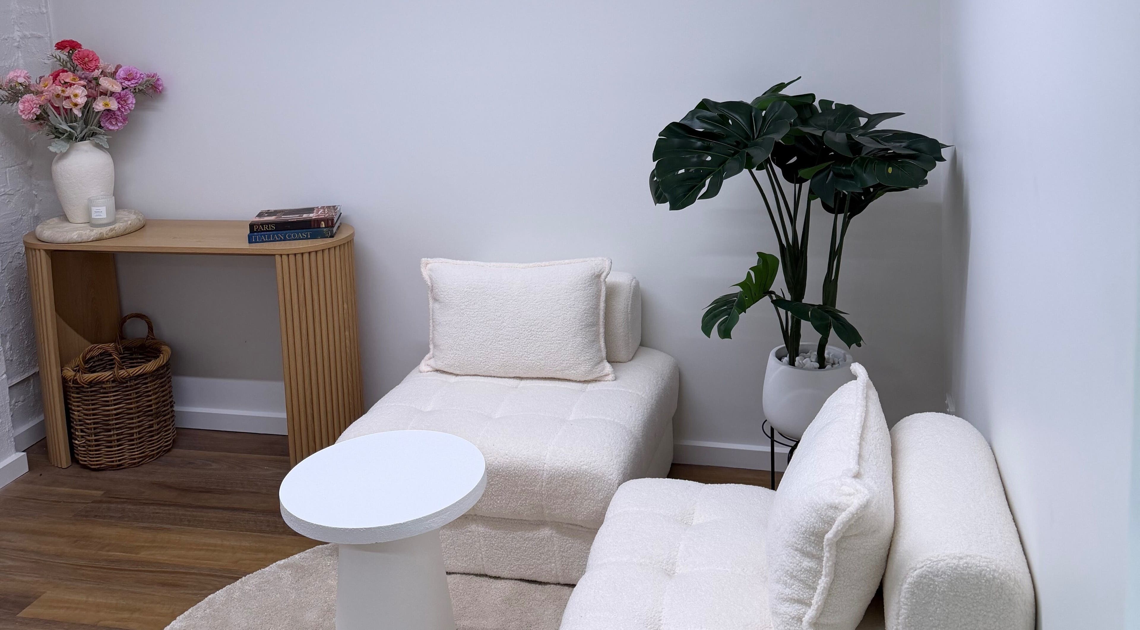 Elegant seating area at BRNZD, Hawker, Australian Capital Territory, AU with plush chairs and decor.