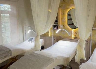 Calming treatment room at Saje Beauty Lagos, Street, Lagos, NG, with elegant drapery and ambient lighting.