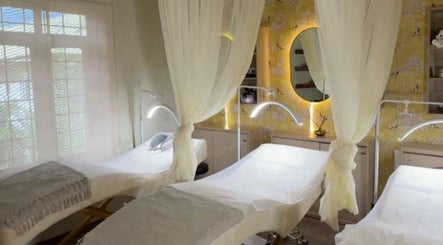 Calming treatment room at Saje Beauty Lagos, Street, Lagos, NG, with elegant drapery and ambient lighting.