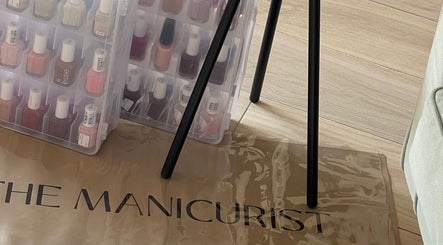 Nail polish collection at The Manicurist, Dubai, Abu Dhabi, AE, showcasing a variety of vibrant colors.