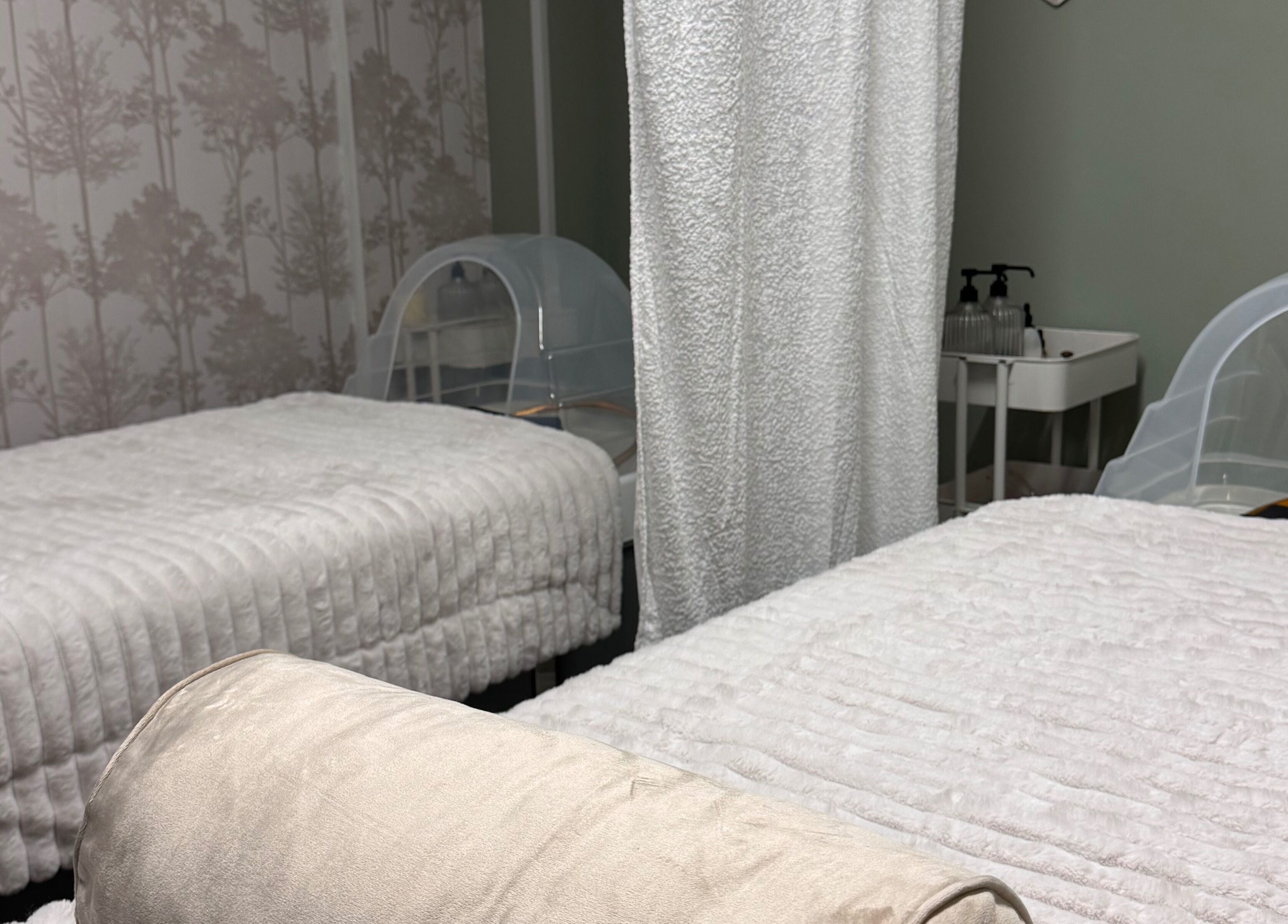 Relaxing treatment beds at Kc Aesthetics And Head Spa, Neyland, Wales, GB, offering a tranquil wellness atmosphere.