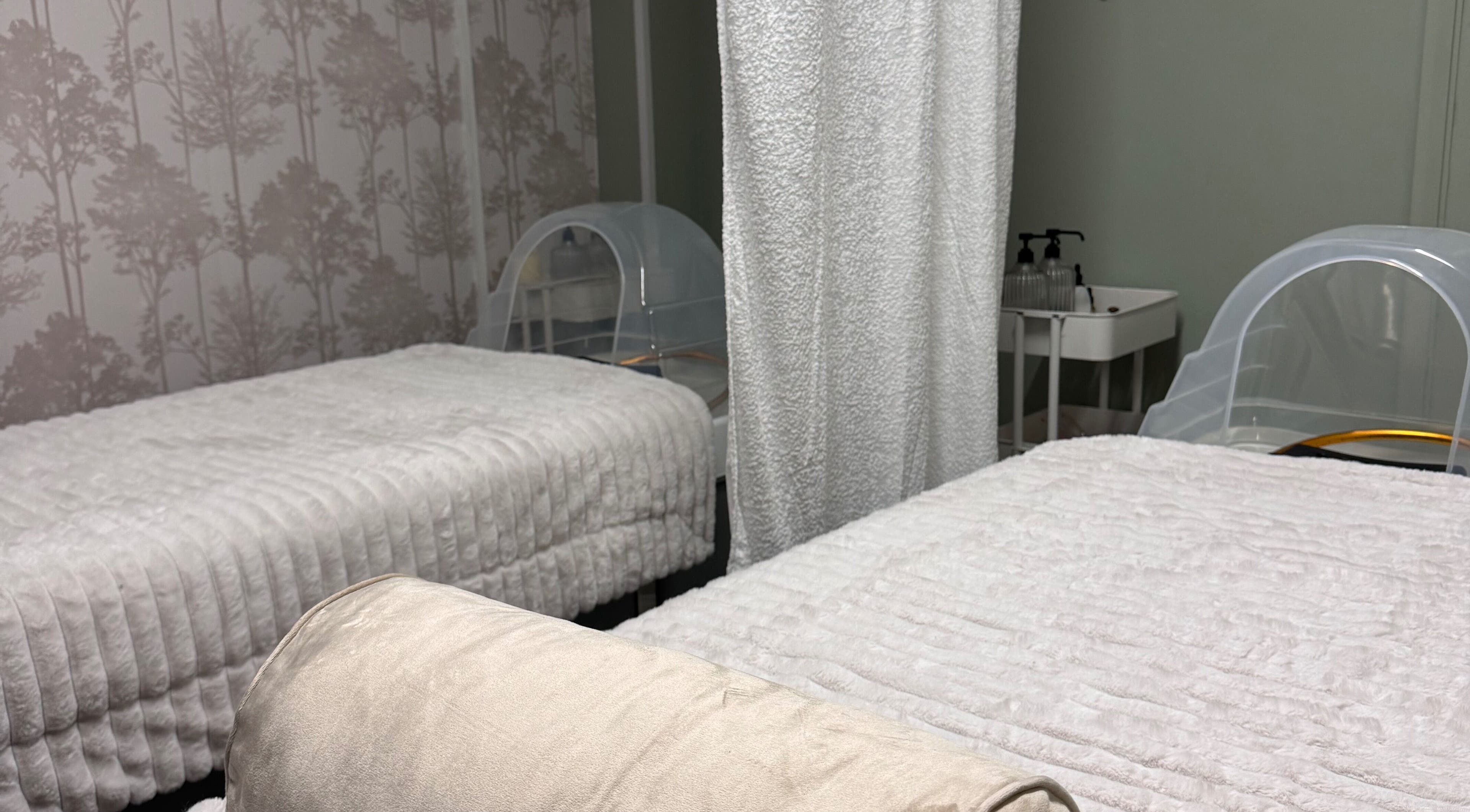 Relaxing treatment beds at Kc Aesthetics And Head Spa, Neyland, Wales, GB, offering a tranquil wellness atmosphere.