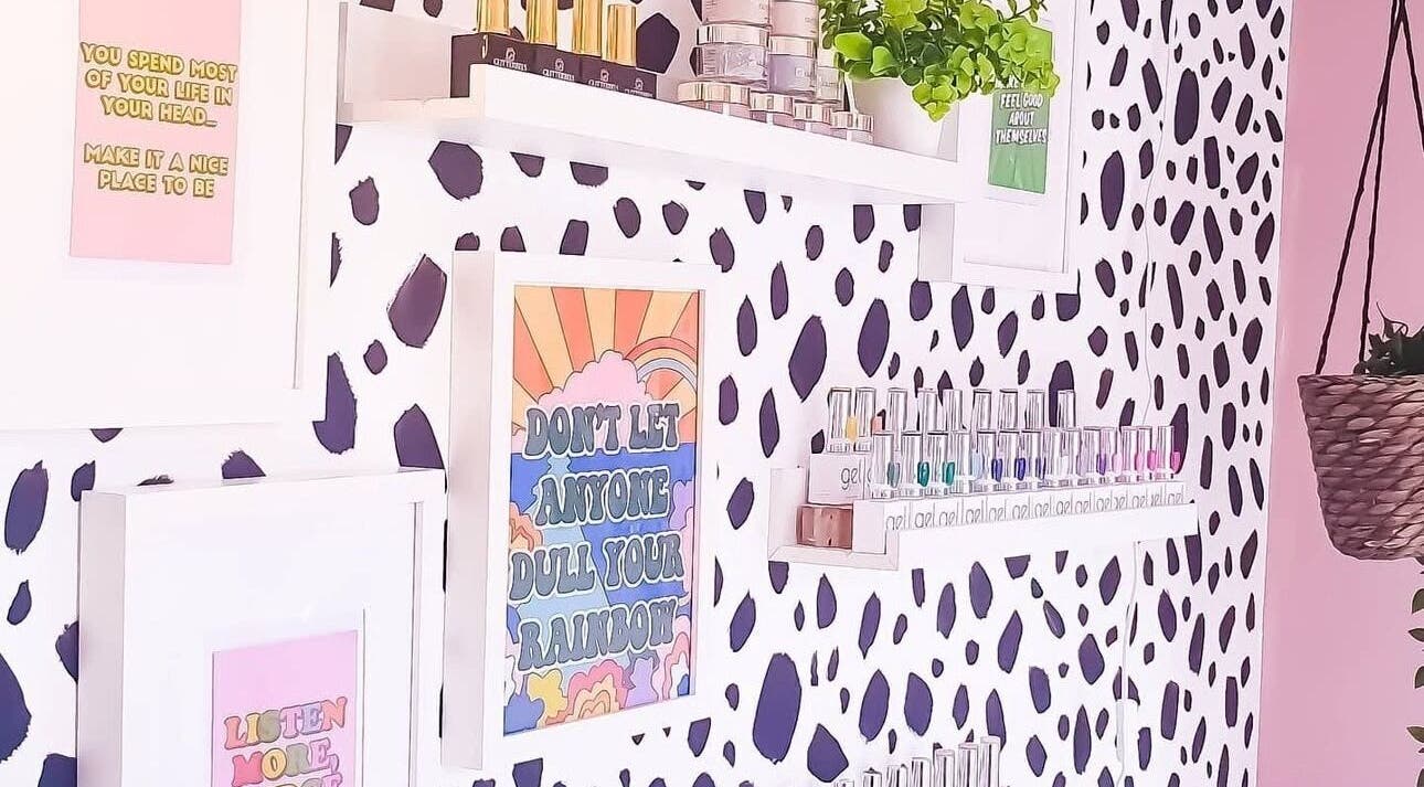 Stylish nail polish wall at Beautiques Nails, Burton Upon Trent, England, GB with quotes and decor accents.