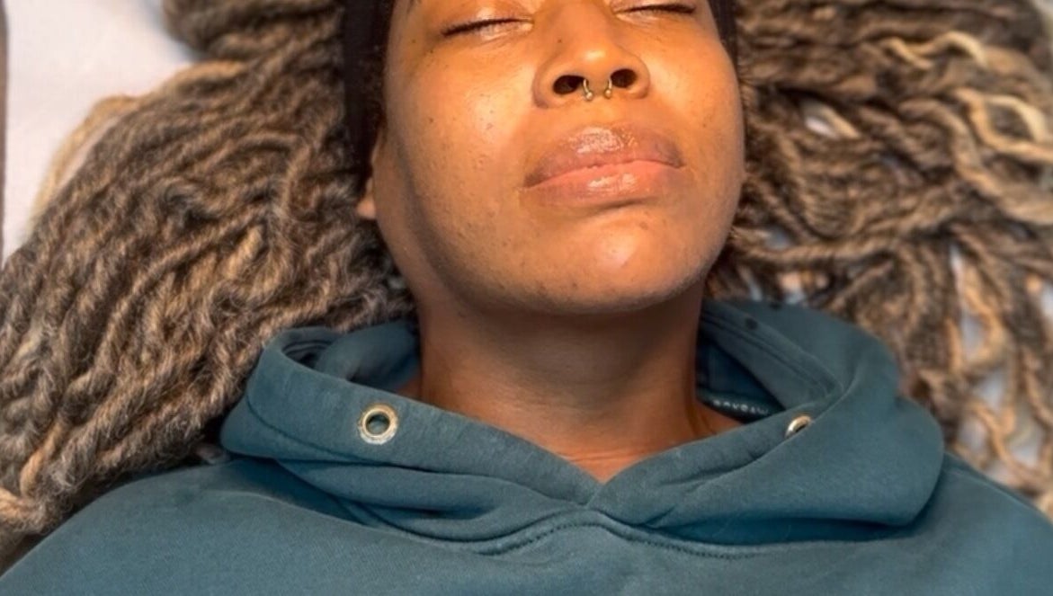 Client enjoying a relaxing facial treatment at SkinSoNü, Prestwich, England, GB.