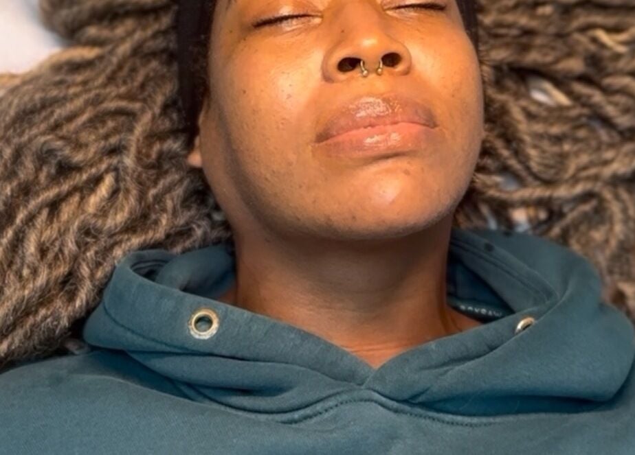 Client enjoying a relaxing facial treatment at SkinSoNü, Prestwich, England, GB.