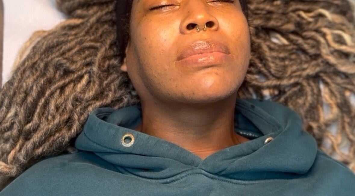 Client enjoying a relaxing facial treatment at SkinSoNü, Prestwich, England, GB.