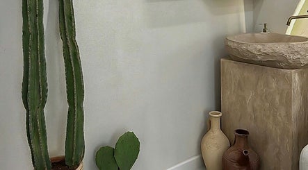 Elegant stone sink and decor at Zan Beauty | زان بيوتي, located in Riyadh, Riyadh Province, SA.