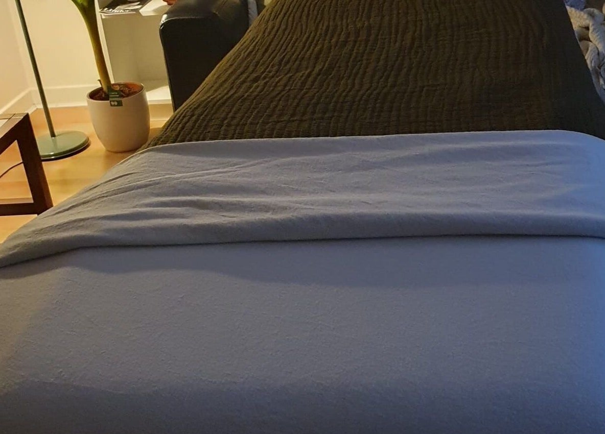 Cozy massage bed in The Zen Hen, Glasgow, Scotland, GB surrounded by calm decor.