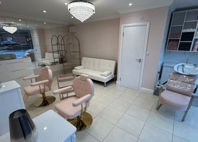 Elegant interior of Rose Gold hair & beauty in Hounslow, England, GB showcasing stylish seating and decor.