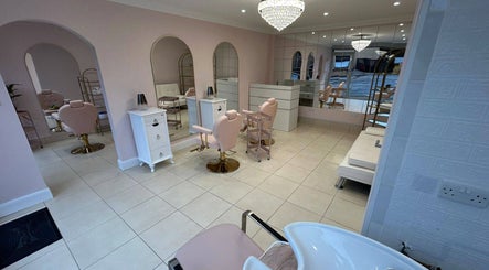 Luxurious interior of Rose Gold Hair & Beauty salon in Hounslow, England, GB, with chic decor and seating.