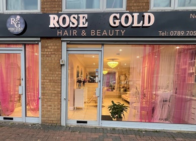 Front view of Rose Gold Hair & Beauty in Hounslow, England, GB, with pink decor and stylish interior.