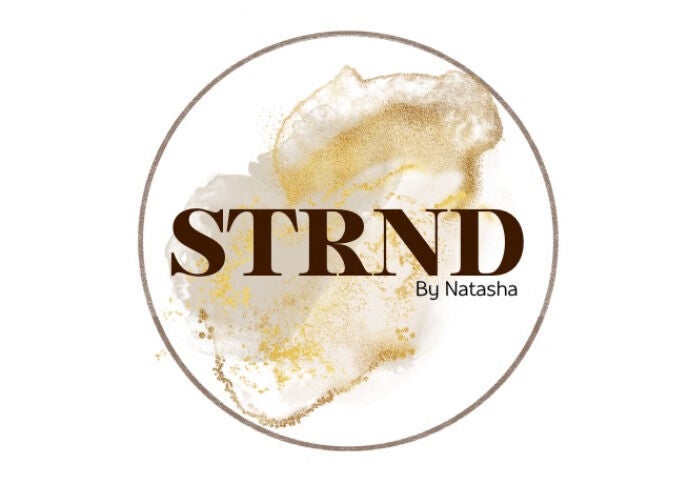 STRND By Natasha logo featuring gold accents in Glasgow, Scotland, GB.