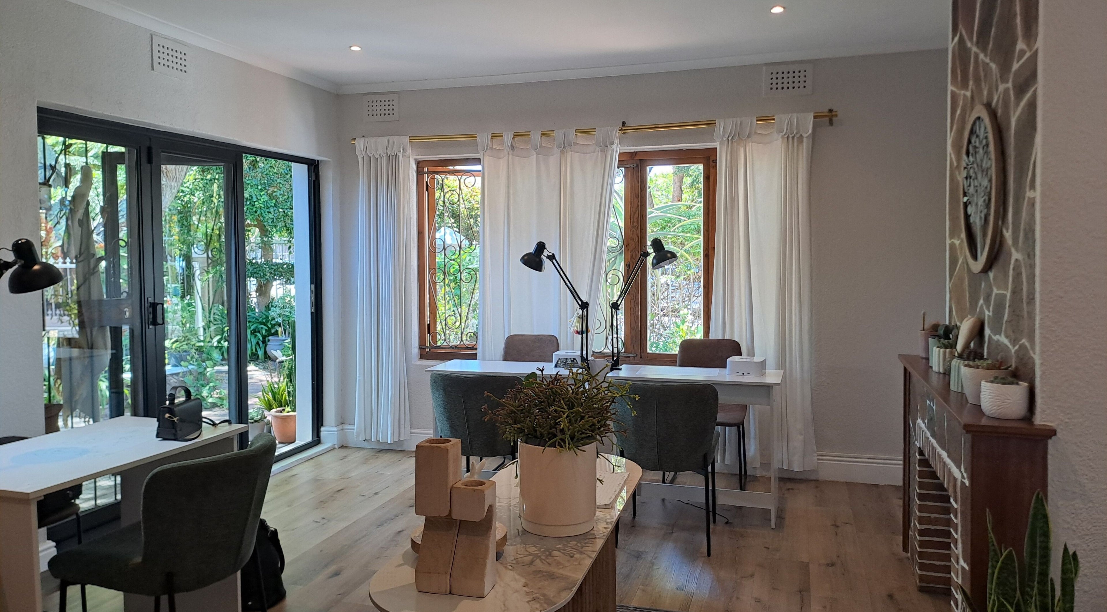 Modern nail salon interior at Gabi's Nail Co, Cape Town, Western Cape, ZA with elegant decor and plants.