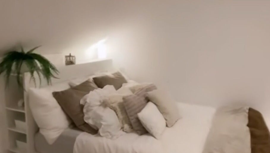 Inviting room at icedbyrosey_ with white linens and warm lighting in Kardinya, Western Australia, AU.