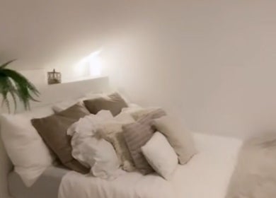 Inviting room at icedbyrosey_ with white linens and warm lighting in Kardinya, Western Australia, AU.