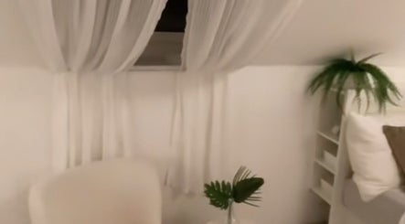 Peaceful interior at icedbyrosey_ in Kardinya, Western Australia, AU, featuring relaxing white decor and plants.