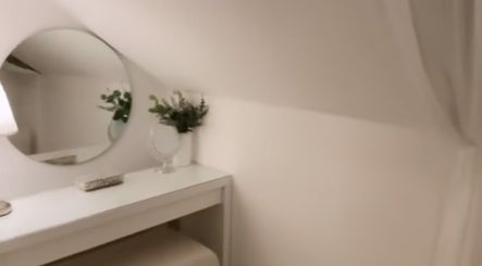 Elegant vanity at icedbyrosey_ in Kardinya, Western Australia, AU featuring a round mirror and decor.