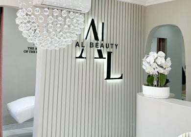 Chic interior of AL Beauty Bar in Centurion, Gauteng, ZA with crystal chandelier and modern decor.