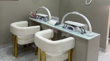 Elegant nail station at AL Beauty Bar in Centurion, Gauteng, ZA featuring plush chairs and modern design.